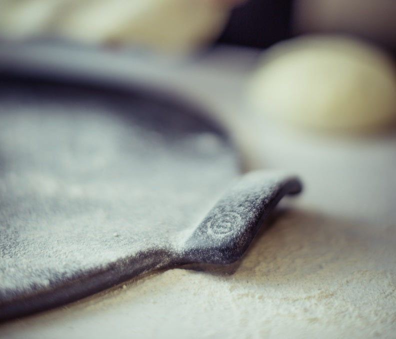 Emile Henry Smooth Pizza Stone Charcoal Black by Kitchen Niche